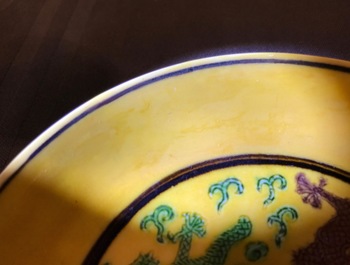 A Chinese yellow-ground dragon saucer dish, Kangxi