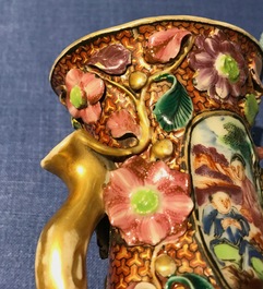 A pair of Chinese famille rose relief-decorated mandarin vases, Qianlong