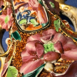 A pair of Chinese famille rose relief-decorated mandarin vases, Qianlong