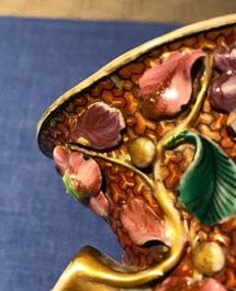 A pair of Chinese famille rose relief-decorated mandarin vases, Qianlong