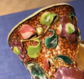 A pair of Chinese famille rose relief-decorated mandarin vases, Qianlong