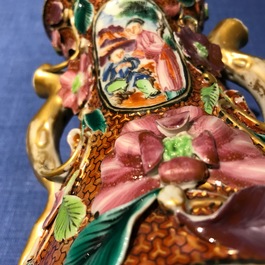 A pair of Chinese famille rose relief-decorated mandarin vases, Qianlong