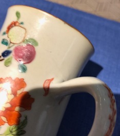Five Chinese famille rose and blue and white mugs and a covered jug, mostly Qianlong