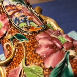 A pair of Chinese famille rose relief-decorated mandarin vases, Qianlong