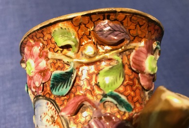 A pair of Chinese famille rose relief-decorated mandarin vases, Qianlong