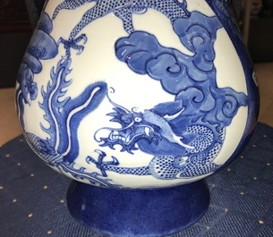 A Chinese blue and white relief-decorated hu vase with mythical beasts, Chenghua mark, 19/20th C.
