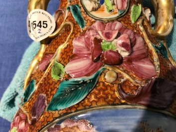 A pair of Chinese famille rose relief-decorated mandarin vases, Qianlong