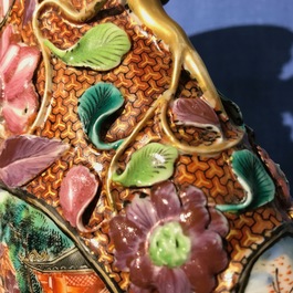 A pair of Chinese famille rose relief-decorated mandarin vases, Qianlong