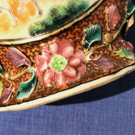 A pair of Chinese famille rose relief-decorated mandarin vases, Qianlong