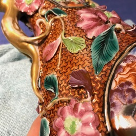 A pair of Chinese famille rose relief-decorated mandarin vases, Qianlong