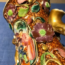 A pair of Chinese famille rose relief-decorated mandarin vases, Qianlong
