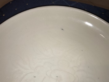 A Chinese Dehua blanc de Chine dish with incised floral design, Kangxi