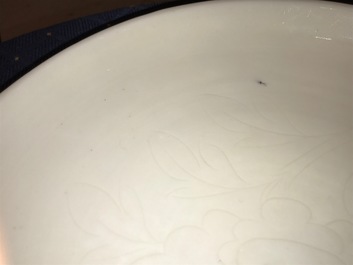 A Chinese Dehua blanc de Chine dish with incised floral design, Kangxi