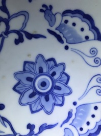 A pair of Chinese famille rose vases and covers, 19th C., and a pair of blue and white dishes, 20th C.