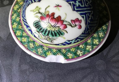 A pair of Chinese famille rose vases and covers, 19th C., and a pair of blue and white dishes, 20th C.