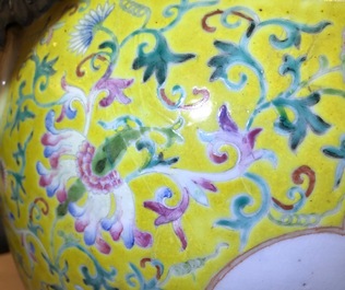 A tall Chinese famille rose yellow-ground vase with a tiger, Qianlong mark, 19th C.