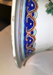 A tall Chinese famille rose vase with a court scene and peacocks, 19th C.