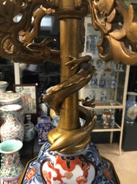 A large brass and gilt bronze-mounted Japanese Imari vase and cover candelabra, 19th C.
