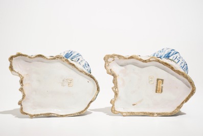 A pair of polychrome Brussels faience candlesticks modelled as chinamen, ca. 1800