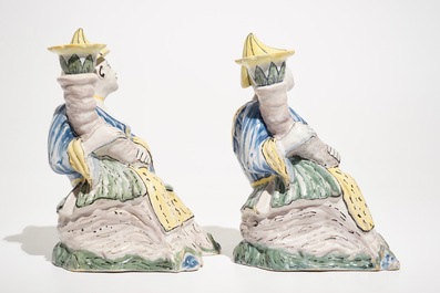 A pair of polychrome Brussels faience candlesticks modelled as chinamen, ca. 1800