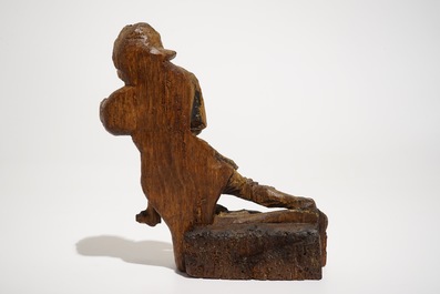 A seated soldier, retable fragment, oak with polychromy, Flanders, 16th C.