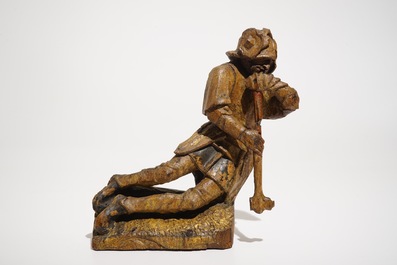 A seated soldier, retable fragment, oak with polychromy, Flanders, 16th C.