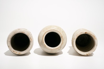 Three monochrome white maiolica albarelli, Italy, 17/18th C.