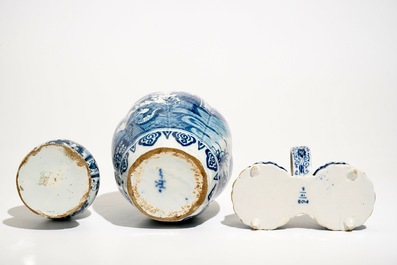 Two Dutch Delft blue and white chinoiserie vases and a cruet stand, 17/18th C.