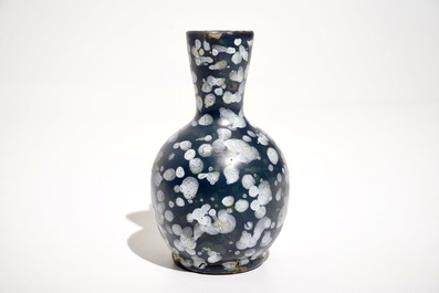 A French faience jug with blue ground "A la bougie" design, Nevers, 17th C.