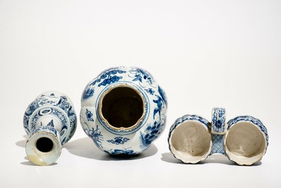 Two Dutch Delft blue and white chinoiserie vases and a cruet stand, 17/18th C.