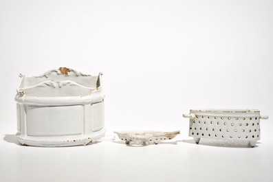 A white Dutch Delft letter holder and two strainers, 18th C.