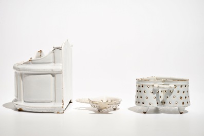 A white Dutch Delft letter holder and two strainers, 18th C.