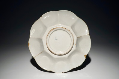 A Dutch Delft polychrome dish with the arms of Orange-Nassau, 2nd half 17th C.