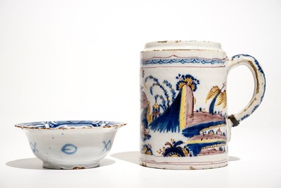 A Dutch Delft blue and white chinoiserie bowl and a polychrome Braunschweig mug, 1st half 18th C.