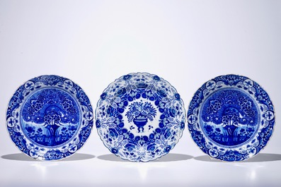 A pair of Dutch Delft blue and white "Tea Tree" dishes and a dish with a flower basket, 18th C.