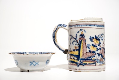 A Dutch Delft blue and white chinoiserie bowl and a polychrome Braunschweig mug, 1st half 18th C.