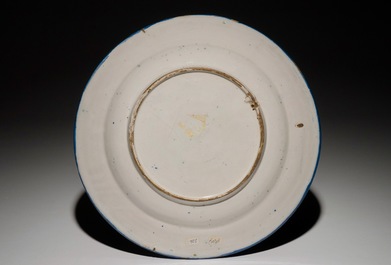 A Dutch Delft blue and white chinoiserie dish with a flower vase in Wanli style, 2nd half 17th C.