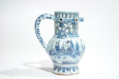 A Dutch Delft blue, white and manganese chinoiserie puzzle jug, dated 1690