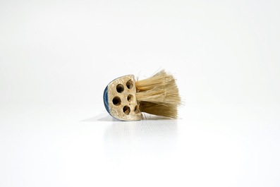 A Dutch Delft blue and white brush with handle, 1st half 18th C.