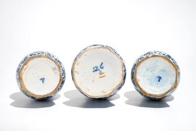 Three Dutch Delft blue and white garlic neck vases with birds on millefiori design, 18th C.