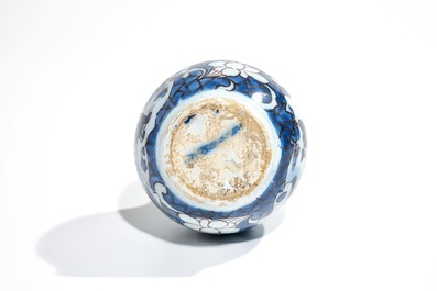 A small Dutch Delft chinoiserie bottle vase in blue, white and manganese, 2nd half 17th C.