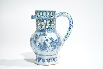 A Dutch Delft blue, white and manganese chinoiserie puzzle jug, dated 1690