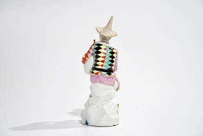 A Meissen porcelain Commedia del'Arte figure of Harlequin playing the bagpipe, 18th C.