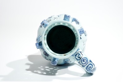 A Dutch Delft blue, white and manganese chinoiserie puzzle jug, dated 1690