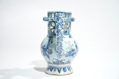 A Dutch Delft blue, white and manganese chinoiserie puzzle jug, dated 1690