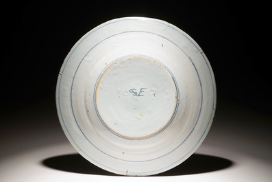 A Dutch Delft blue and white armorial plate, 17th C.