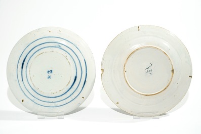 Five Dutch Delft blue and white plates with dragons, tea trees and a peacock's tail, 17/18th C.