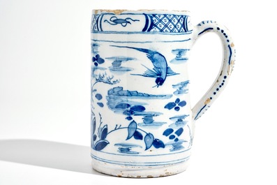 A large Dutch Delft blue and white chinoiserie beer mug, 18th C.
