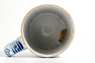 A large Dutch Delft blue and white chinoiserie beer mug, 18th C.