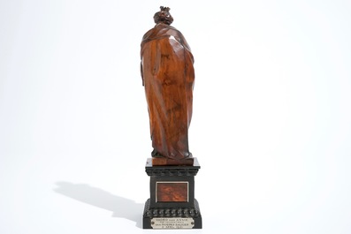 A carved boxwood Madonna with child on tortoise veneer base, 17th C.